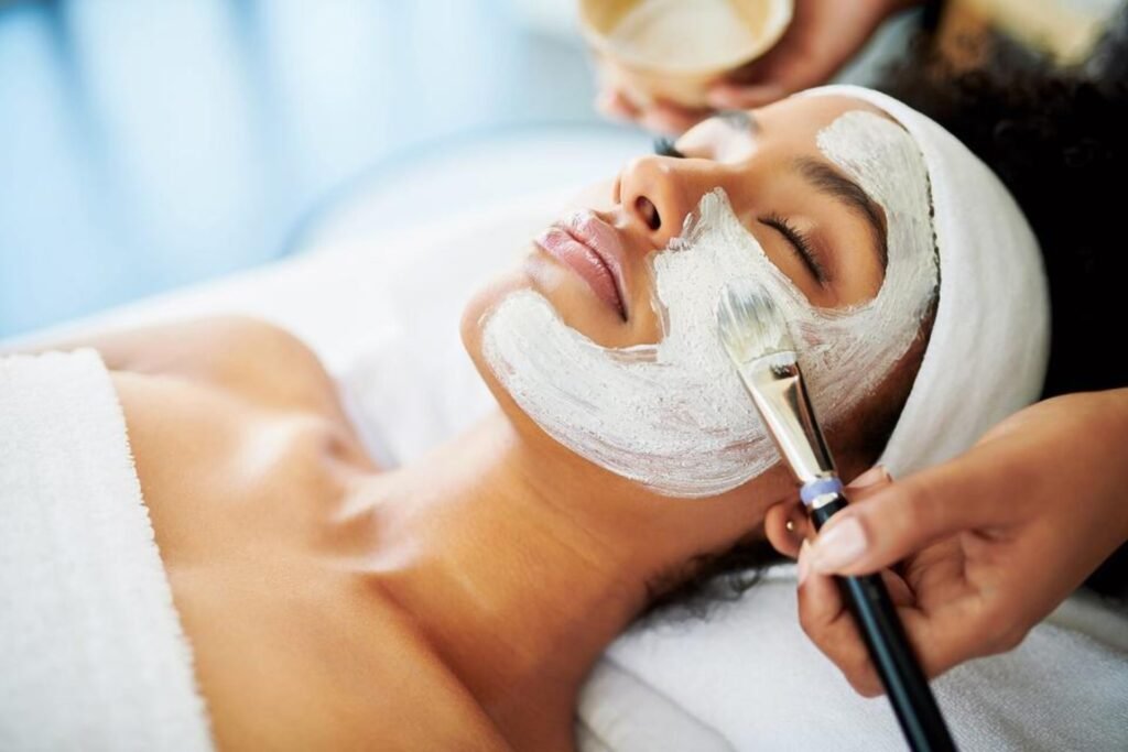 Black woman receiving a rejuvenating facial treatment at a top-rated spa in Virginia Beach, feeling relaxed and refreshed